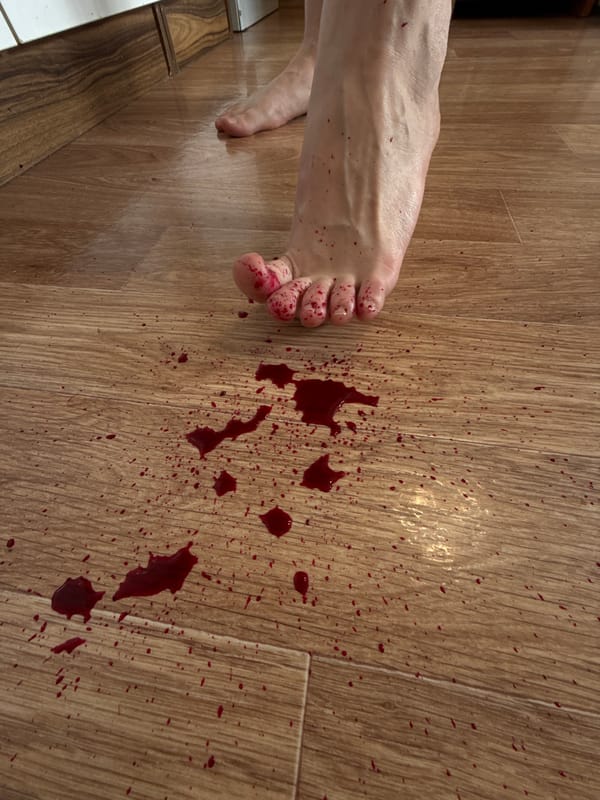 Red liquid spill documented on floor in Krasnoyarsk