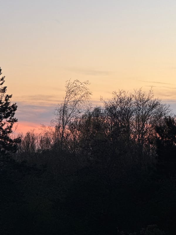 Colorful sunset observed over Great Yarmouth displaying orange-pink bands
