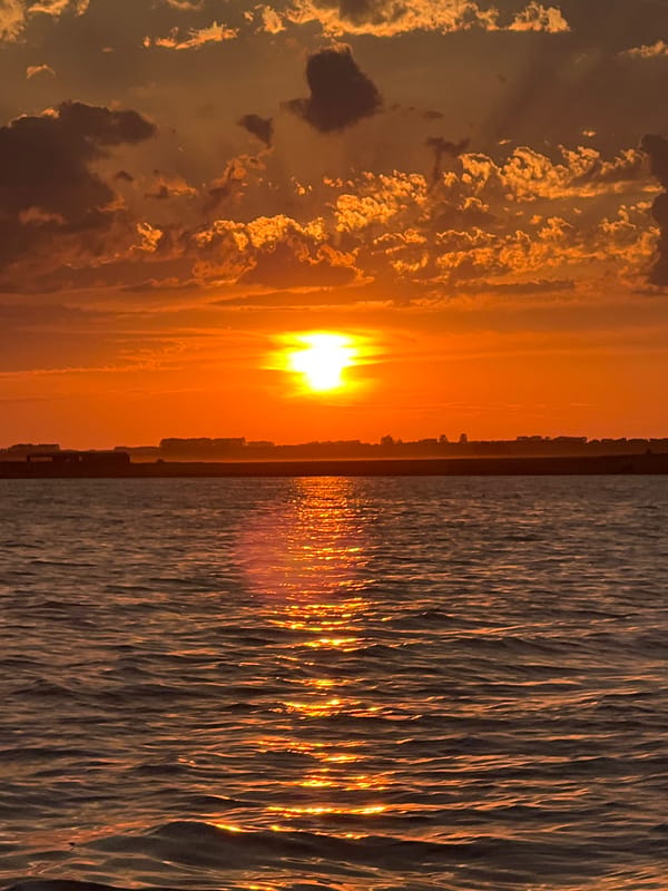 Sunset over the water at Novopichugovo, Russia