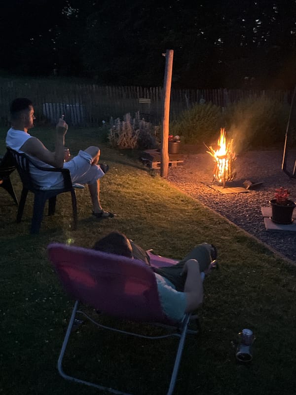 Backyard fire pit gathering on a summer evening