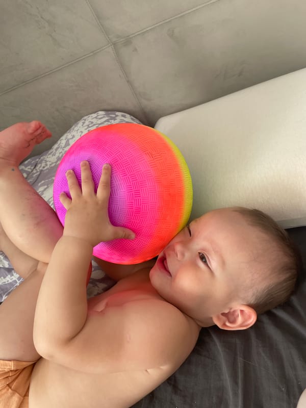 Mother and baby share morning playtime in Perm home