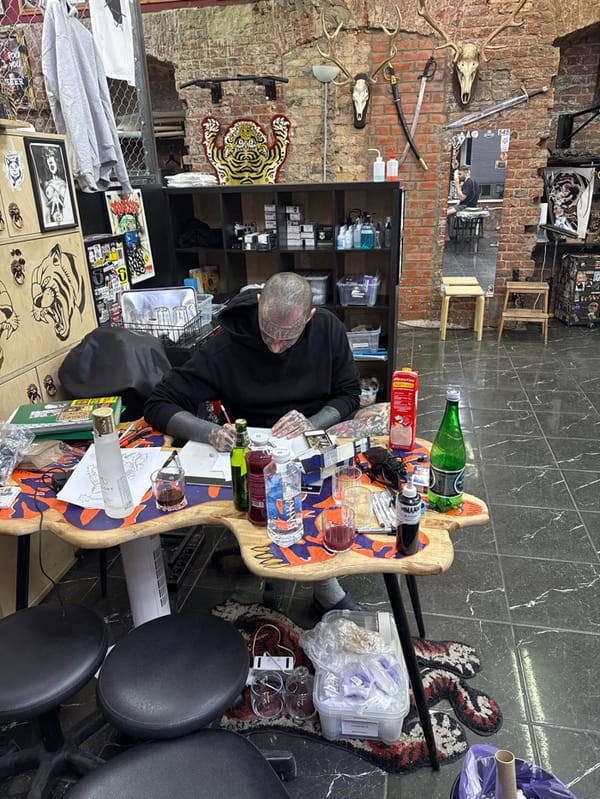 Heavily tattooed person spotted in Moscow tattoo parlor