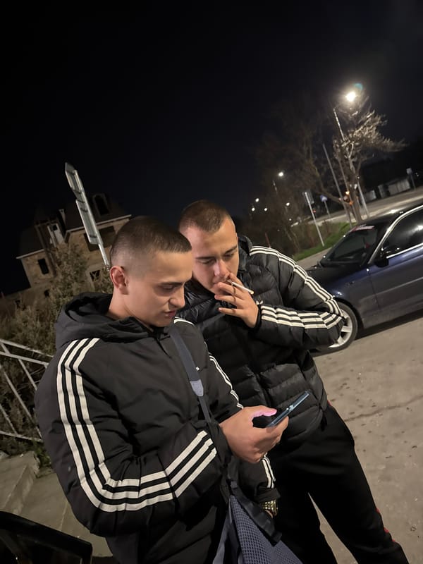 Young men hang out at night in Topoli, Bulgaria