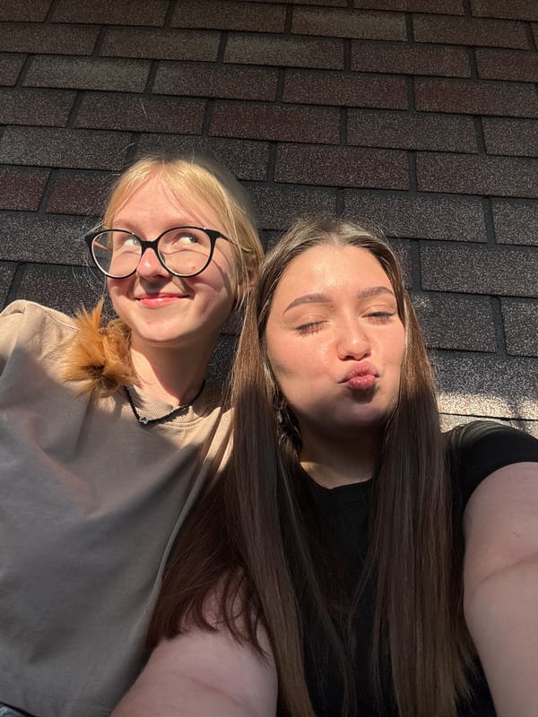 Two women spend sunny afternoon posing outdoors in Krasnokamsk