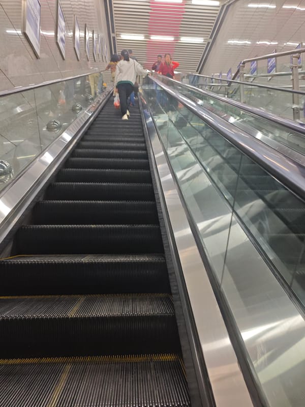 Morning commuter scenes captured on escalators and subway car