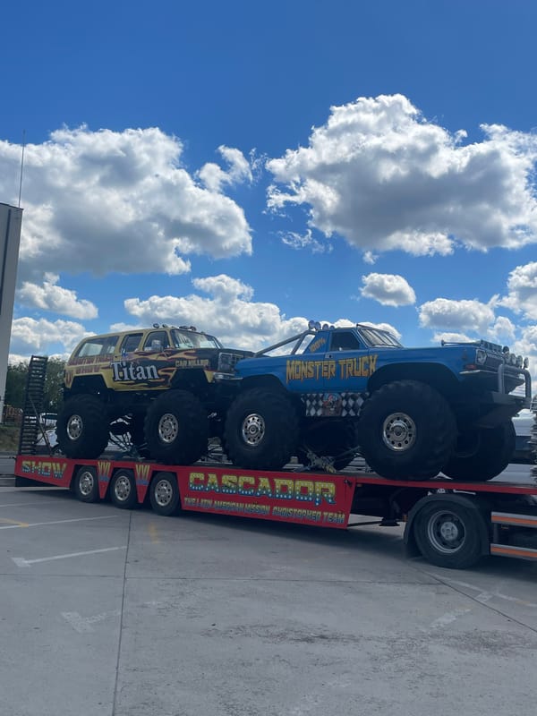 Monster trucks transported on flatbed trailer in Oradea, Romania