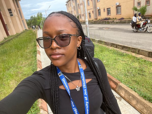 Jos street portraits and surroundings, University of Jos student lanyard visible