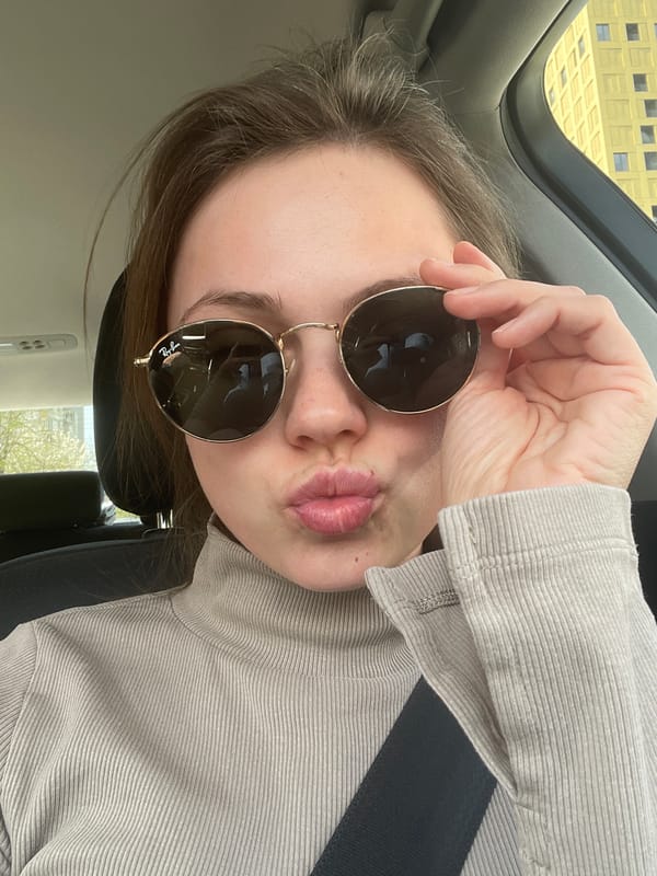 Woman takes car selfies with sunglasses in Ljubljana