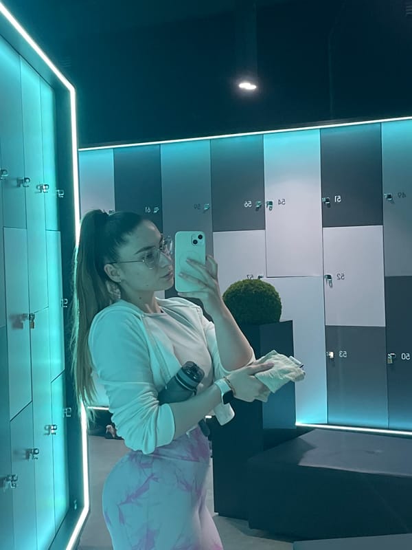 Woman takes selfie in locker room