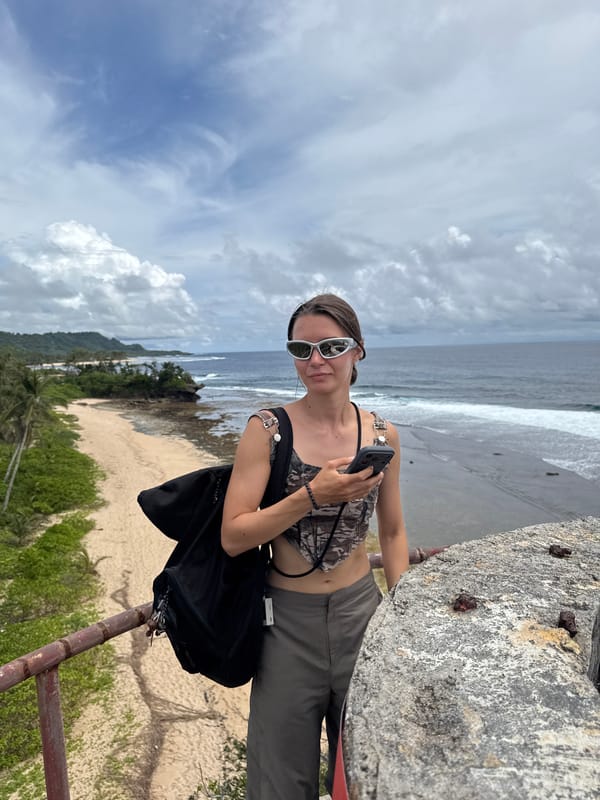 Tourist documents coastal scenery in San Isidro, Philippines