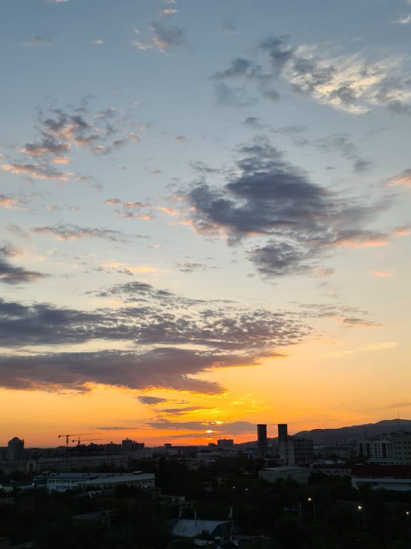 Almaty sunset from multiple angles, city skyline at dusk