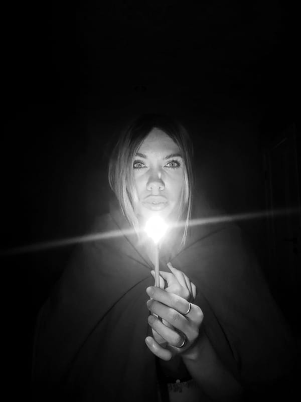 Woman experiments with lighting during indoor photo session