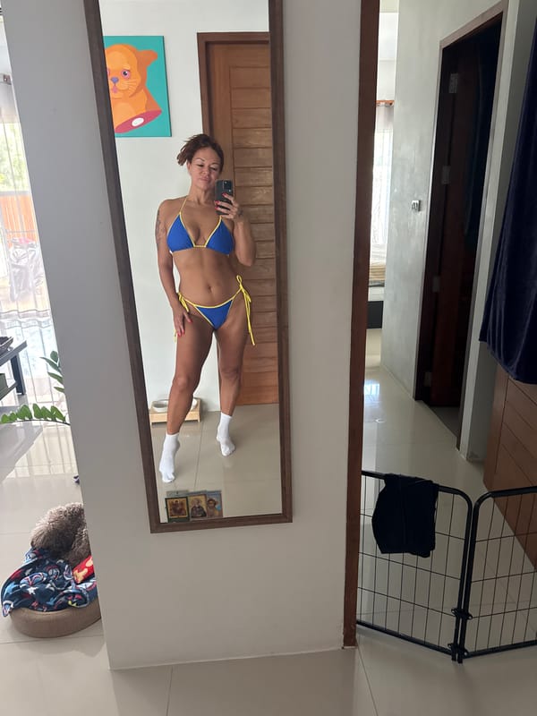 Mirror selfie in a casual home setting, Thep Krasatti