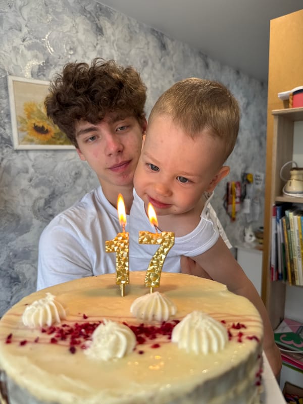 Toddler and adult pose for photo in Rusanovo