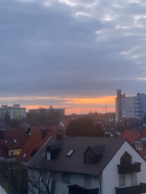 Sunset colors illuminate Munich residential skyline