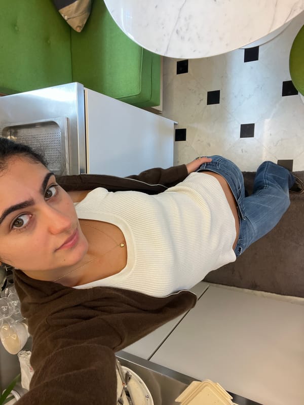 Woman takes high-angle selfies indoors in Paris