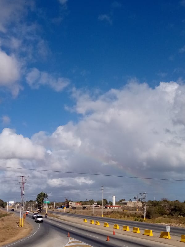 Rainbow appears over highway in El Dátil, Venezuela