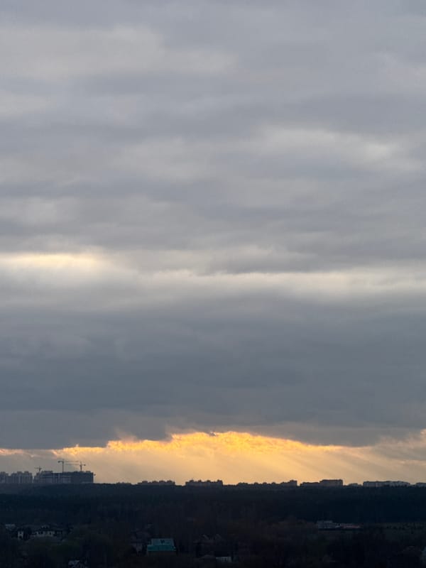 Sunset breaks through clouds over Mirny, Russia