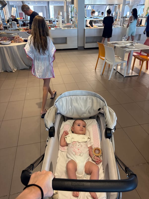 Elevator selfies and a stroller at a Sicilian resort