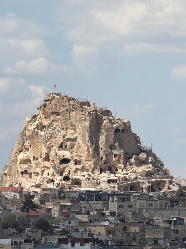 Tourist captures Cappadocia's iconic rock formations and local pigeons