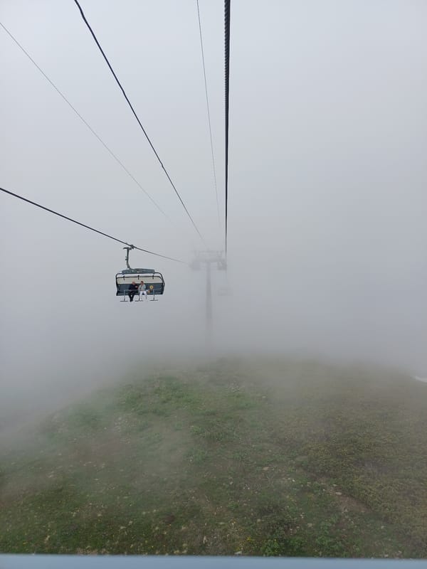 Foggy summer morning at a ski lift in Estosadok, Russia