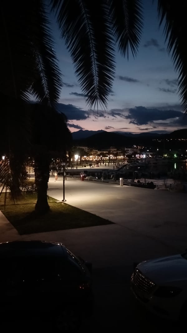 Sunset to twilight along Nea Iraklitsa's harbor promenade