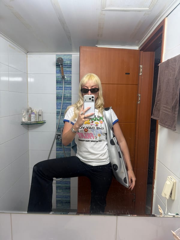 Woman Takes Mirror Selfie in Seoul