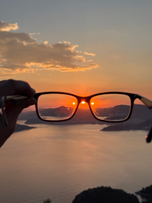 Sunset documented through creative framing at Sveti Stefan, Montenegro