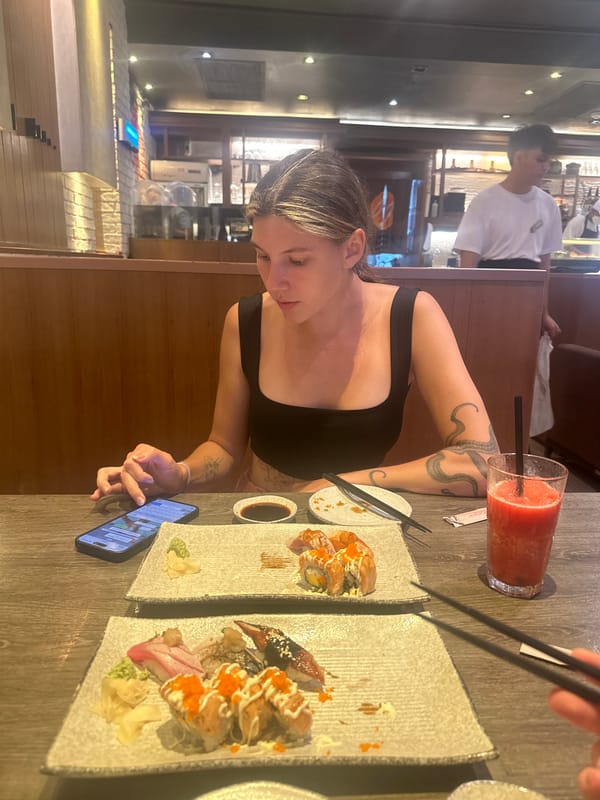 Woman enjoys sushi lunch at Thai restaurant