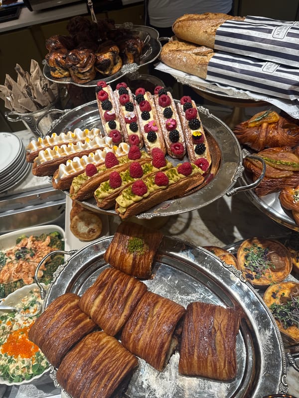 Diner documents pastry buffet and salad meal in Riga cafe