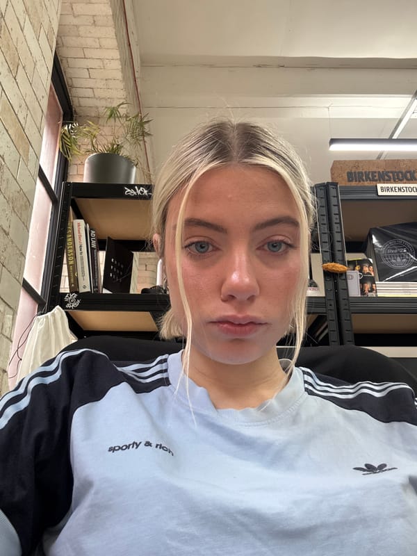 Woman in Adidas sportswear photographed indoors in Manchester