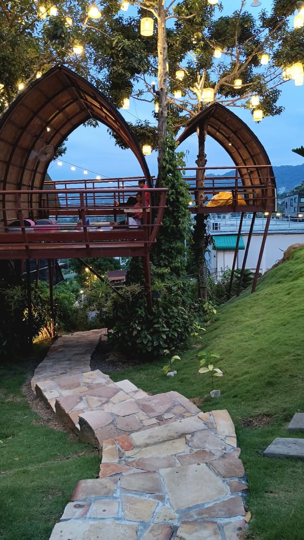 Hillside resort in Ko Samui with pools, koi, and a roaming rabbit