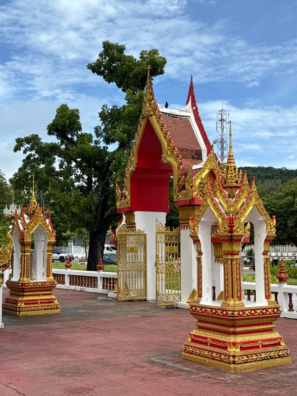 Exploring Wat Chalong's ornate temple grounds in Phuket