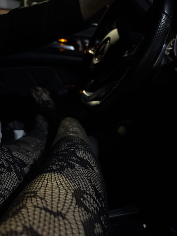 Person in car with legs extended toward window in Plovdiv