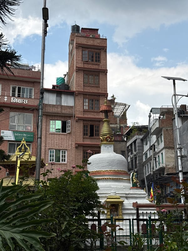 Morning scenes at Boudhanath Stupa with pigeons in Kathmandu