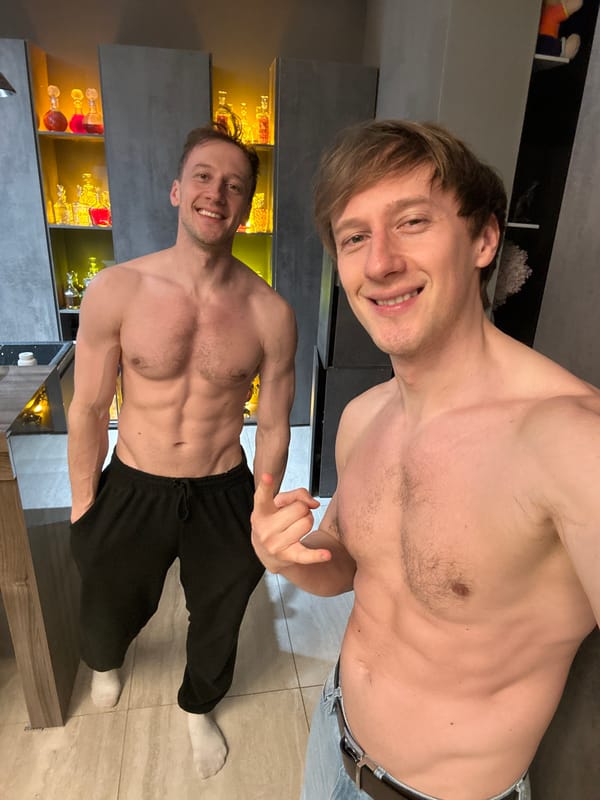 Two men photographed with bottles in Kursk home