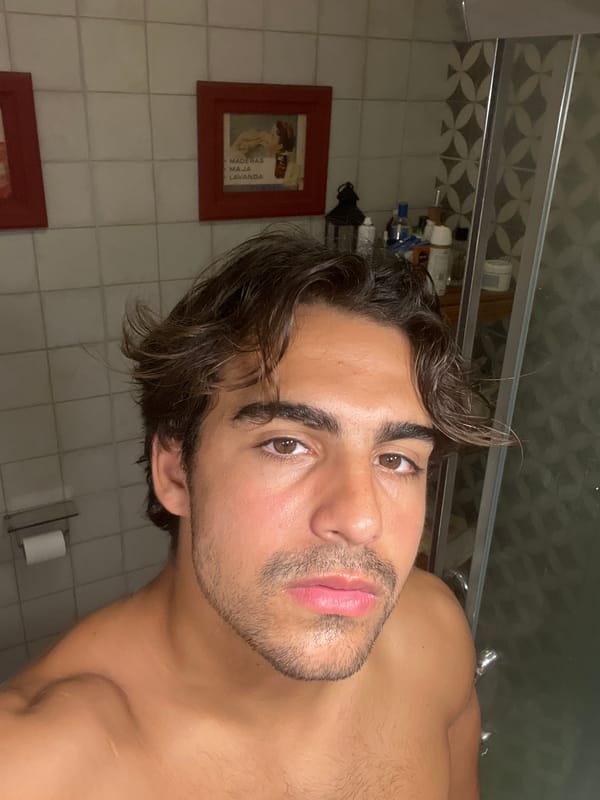 Man takes bathroom mirror selfies in Avellaneda, Argentina