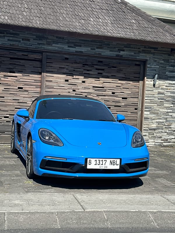 Blue Porsche, rice paddies, and a scooter in North Kuta