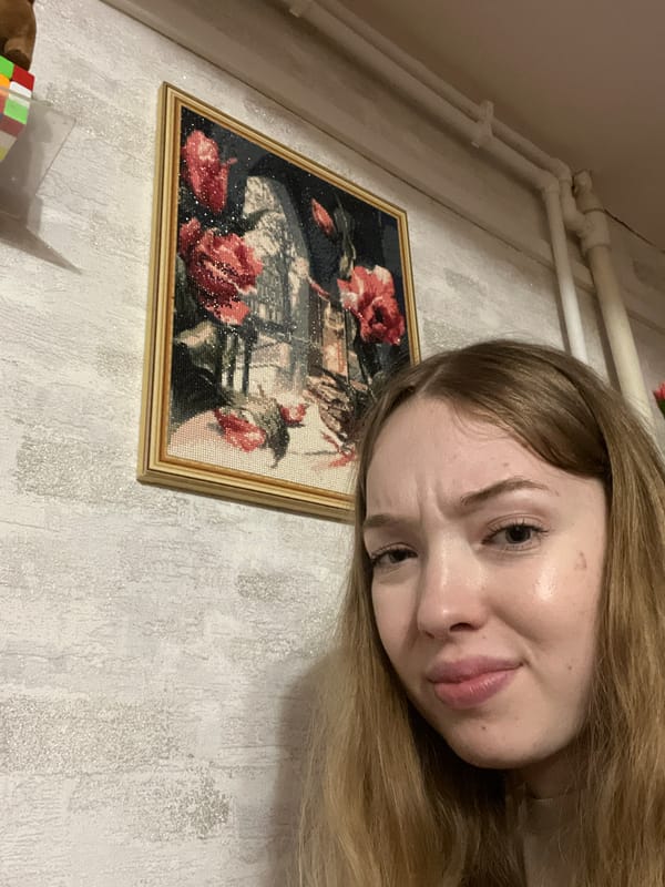 Woman displays embroidery work in Сосново, Russia