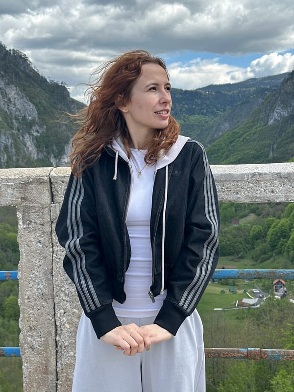 Tourist photographs herself at Montenegro's Tara River Canyon viewpoint