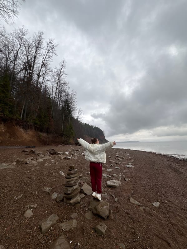 Person spotted on Russian pebble beach under overcast skies