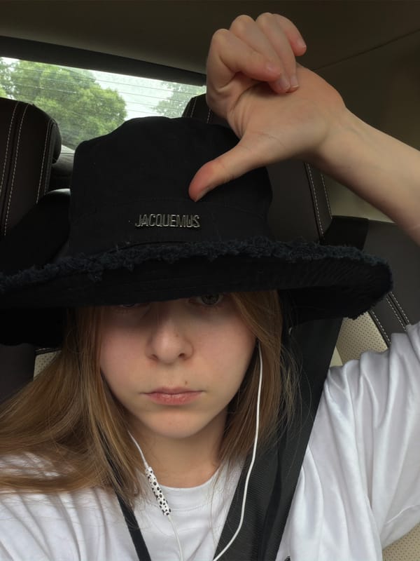 In-car selfie session near Vnukovo airport, Jacquemus hat front and center