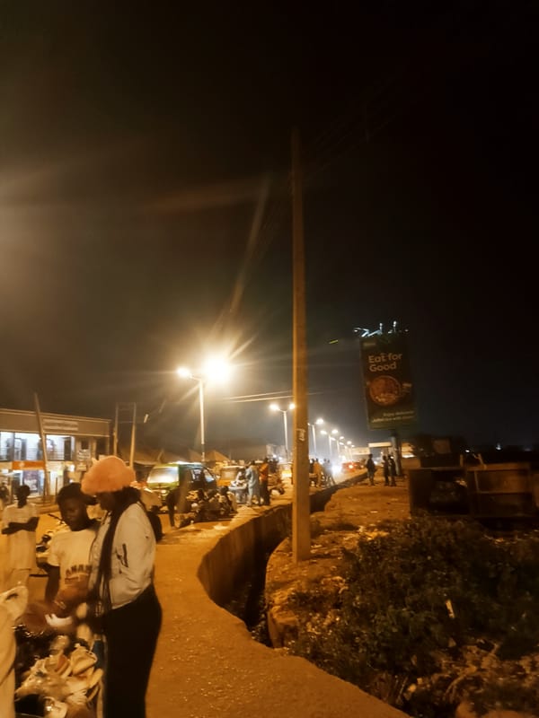 Evening street market bustles with vendors in Bukuru, Nigeria