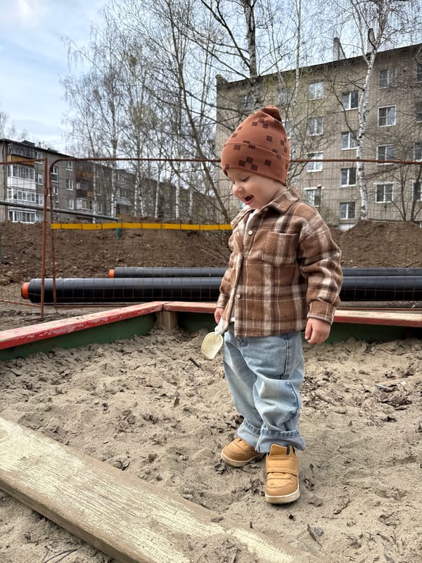 Mother and child enjoy outdoor playtime in Rusanovo