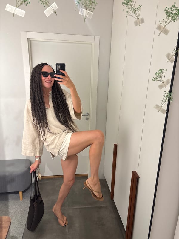 Woman takes mirror selfies in Chaikovsky fitting room