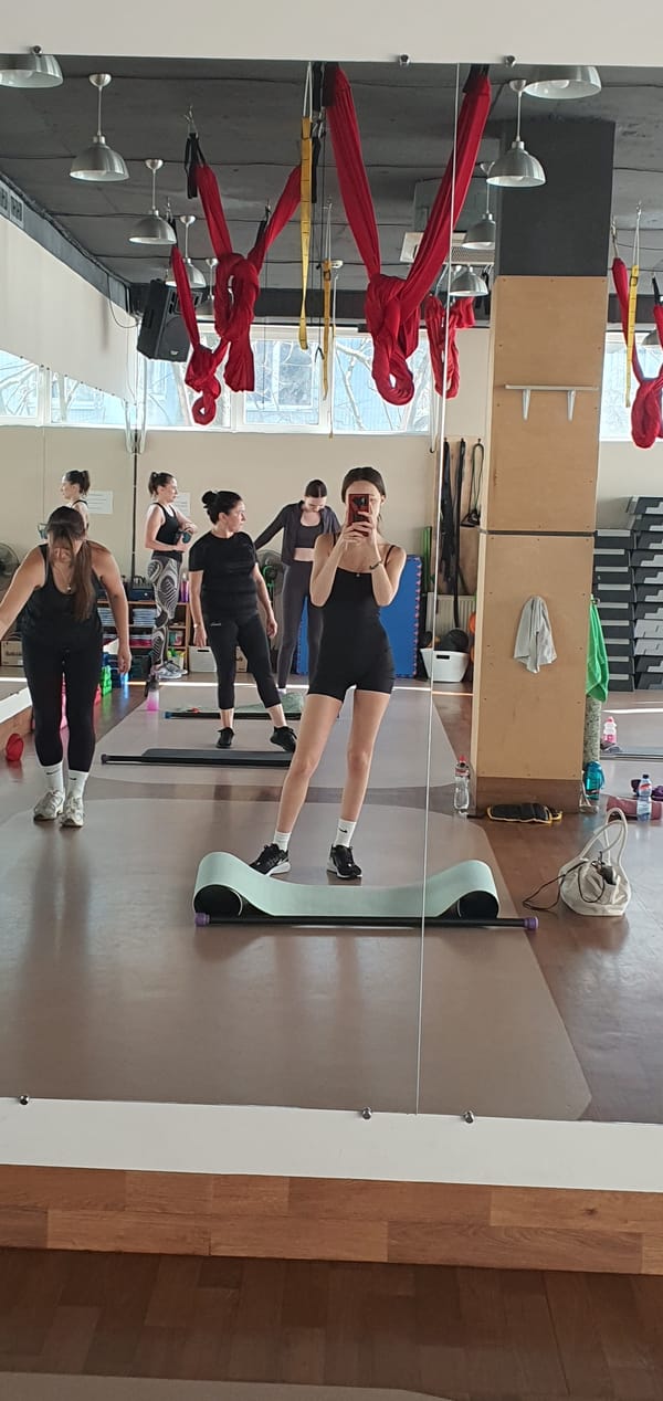 Women take mirror selfies at Odesa fitness studio