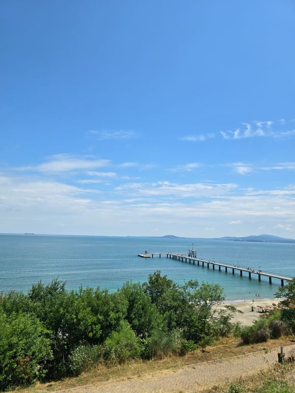 Burgas seafront: pier, ships, and Sea Garden on a calm morning