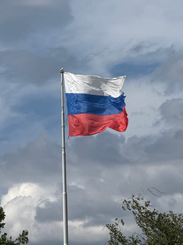 Russian flag and Orthodox church observed in unknown location