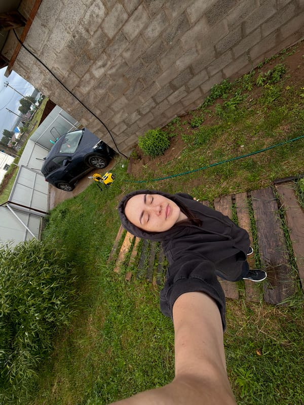 Young woman documents rainy afternoon with selfies, melting ice cream