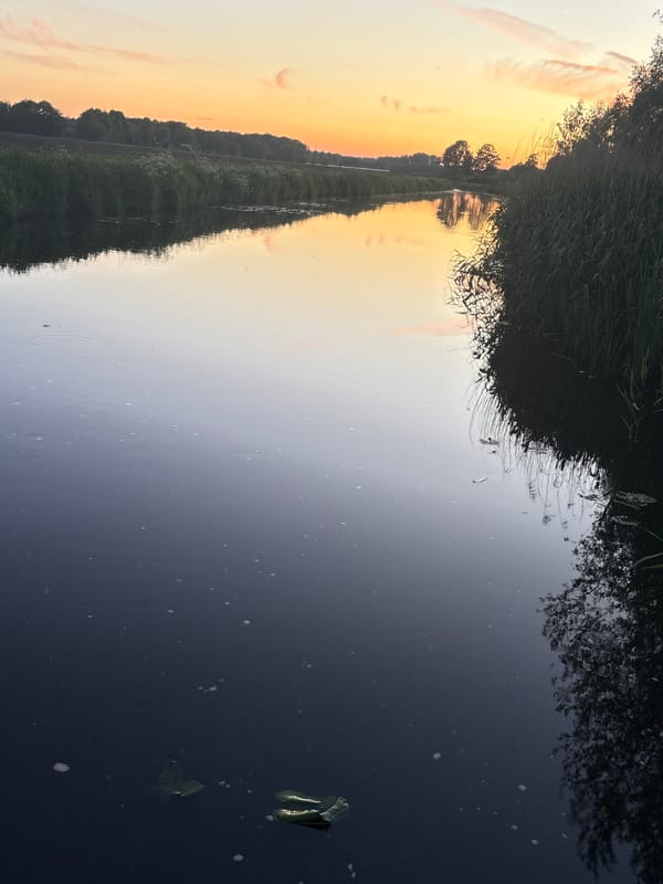 Sunset reflection captured over water body May 18